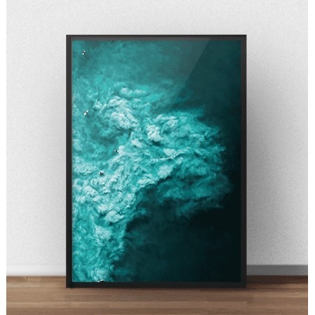 A poster with a beautiful turquoise ocean and windsurfers seen from a bird's eye view